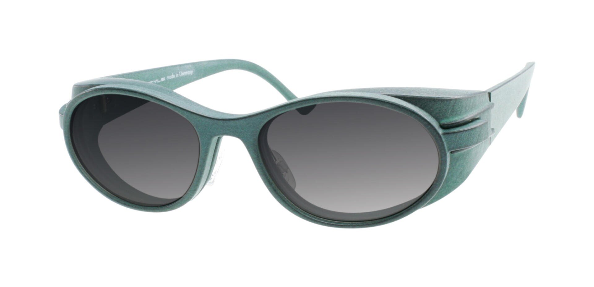 Oval, side protection sunglasses with grey lenses and a thick, matt green frame. The temples are wide with a layered design detail near the hinges.