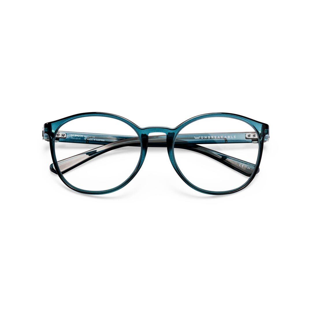 Runde Brille mit transparentem, türkisblauem Rahmen, nach vorne gerichtet auf weißem Hintergrund. Die Bügel sind durch die Gläser sichtbar und auf der Innenseite des linken Bügels ist der Schriftzug UNBREAKABLE aufgedruckt.