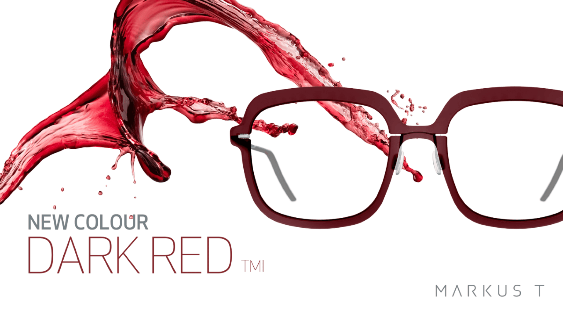 A pair of dark red eyeglasses is displayed with a splash of red liquid behind them. The text reads NEW COLOUR DARK RED™ and MARKUS T on a white background.