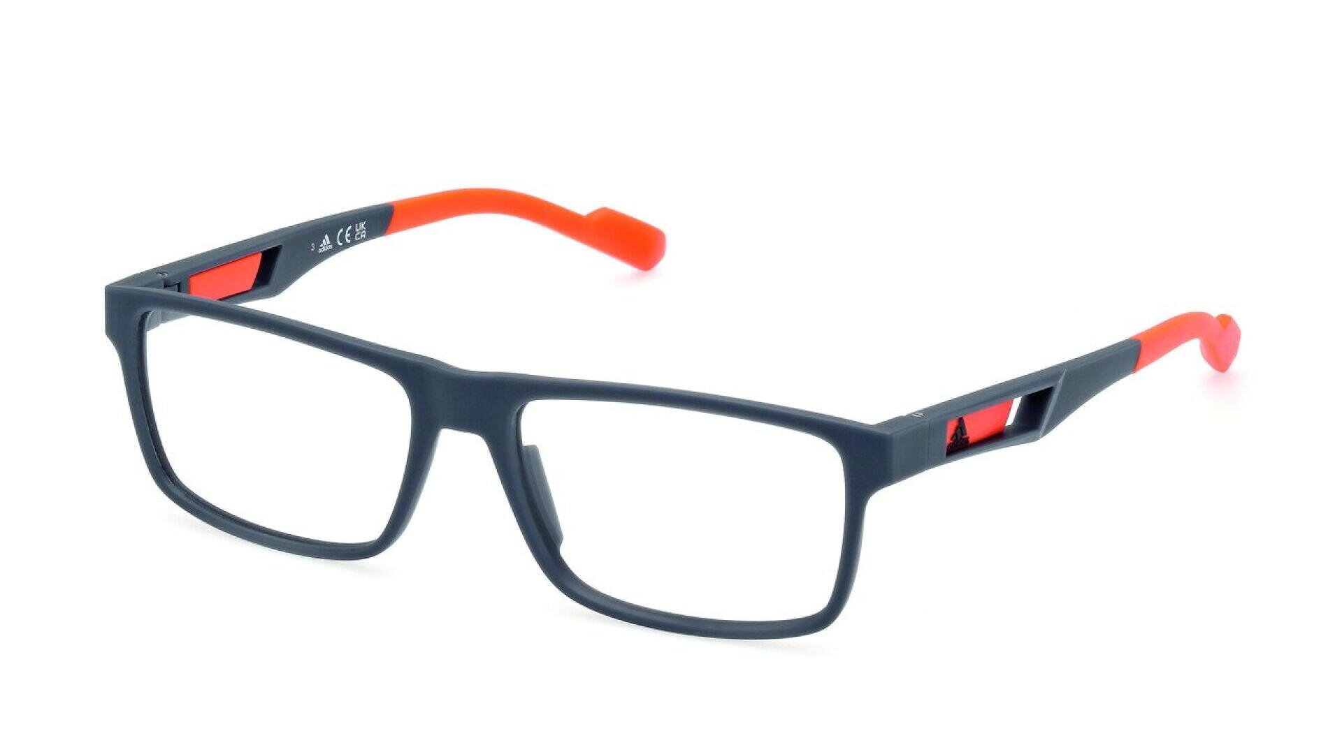 A pair of rectangular eyeglasses with a dark frame and red temple arms, shown on a white background. The glasses have a modern design with a small cutout near the hinges.