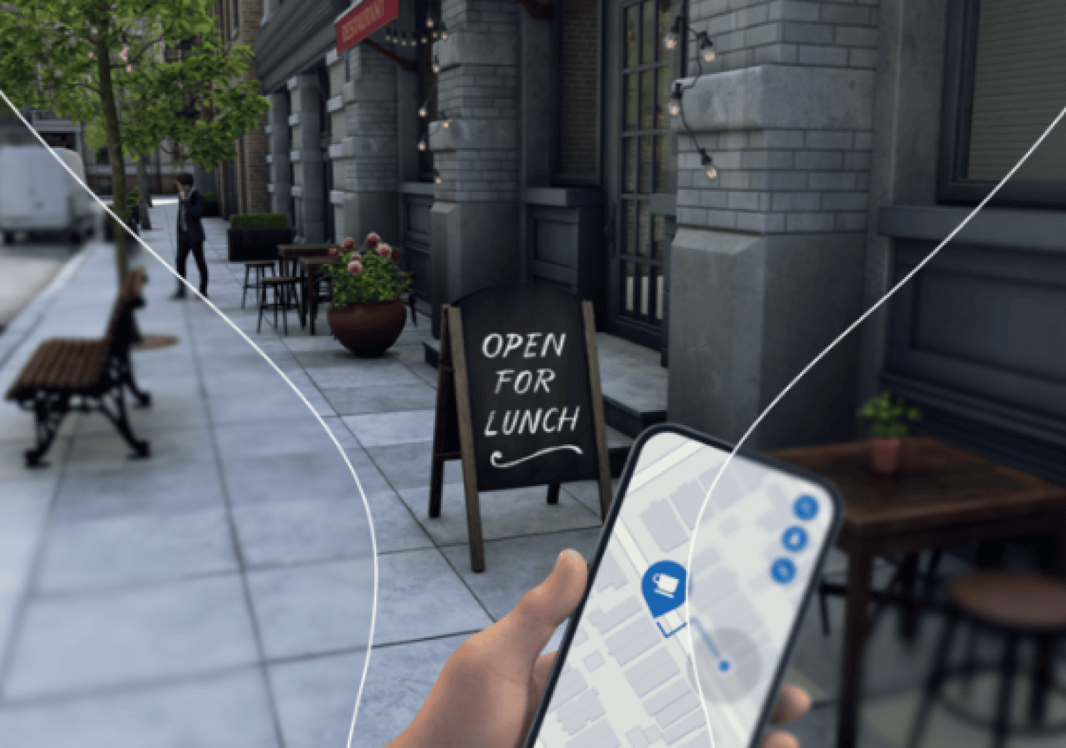 A person is holding a smartphone showing a map in front of a restaurant labeled OPEN FOR LUNCH on a sidewalk with benches, trees and fairy lights.
