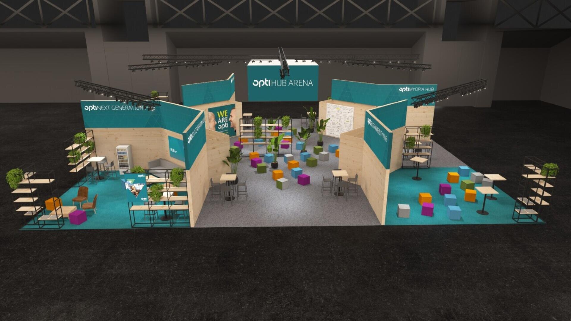 A large, modern exhibition booth with turquoise carpeting, wood panel walls, seating areas with colorful chairs and cube stools, plants, and signs reading opti HUB ARENA and WE ARE OPTI.