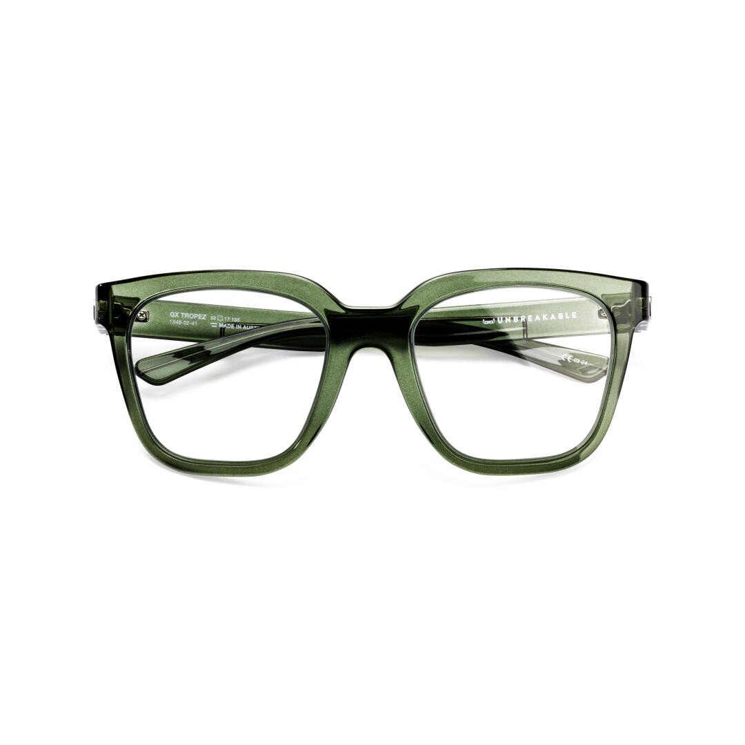 Eine grüne, rechteckige Brille mit dickem Rahmen, von vorne mit leicht geöffneten Bügeln abgebildet. Der Markenname DISPOSABLE ist auf der linken Innenseite des Bügels sichtbar.